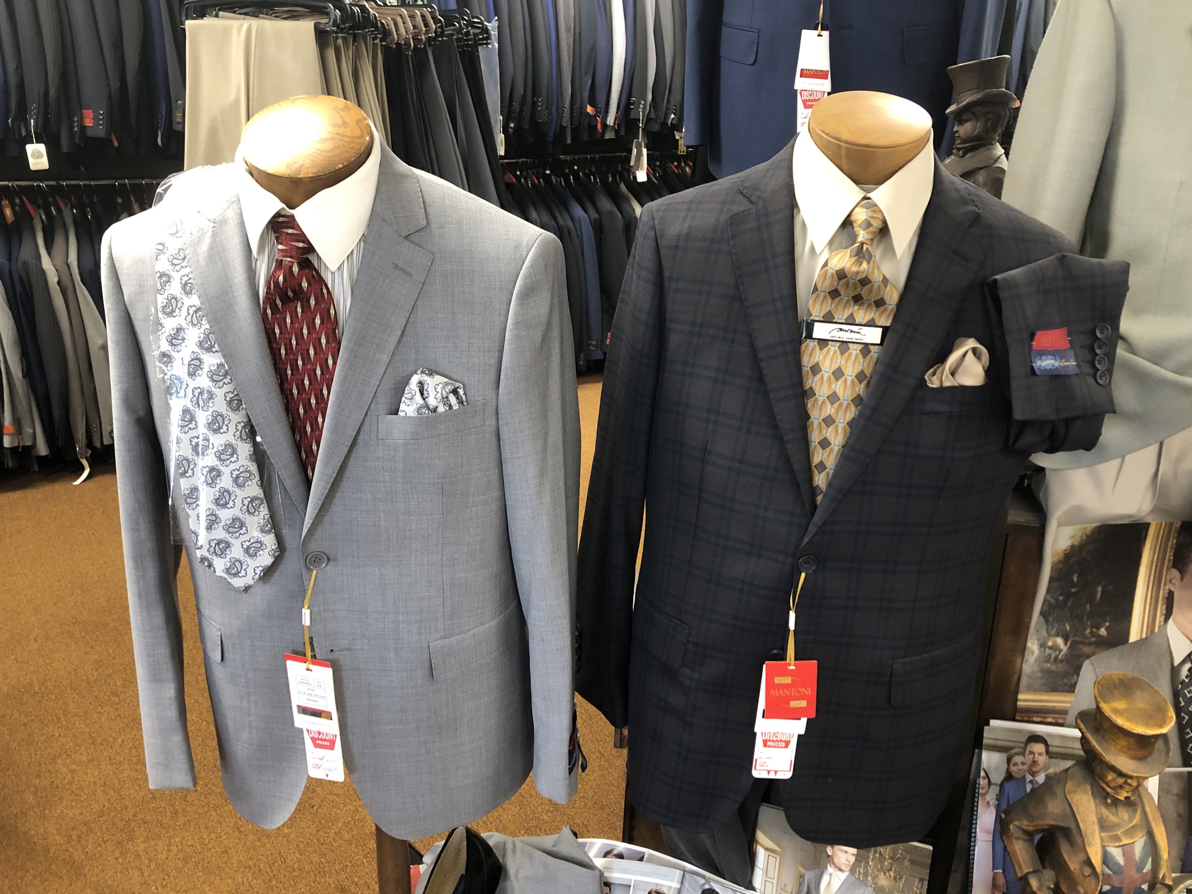 Two tailored suits on display